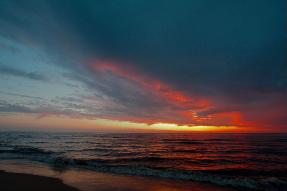 Zonsondergang aan zee