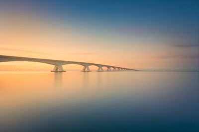 A minimalist sunset on an iconic bridge in a tranquil setting