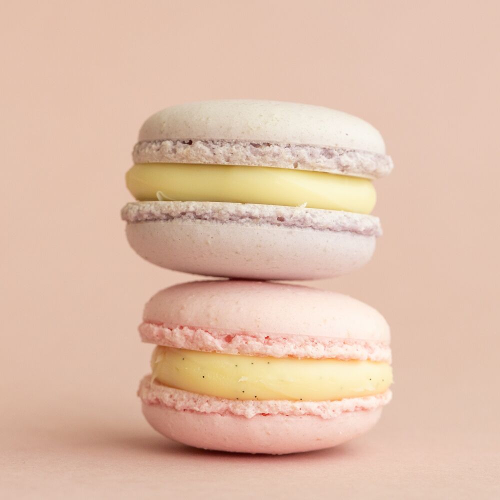 Delicate macaroons on a pink background