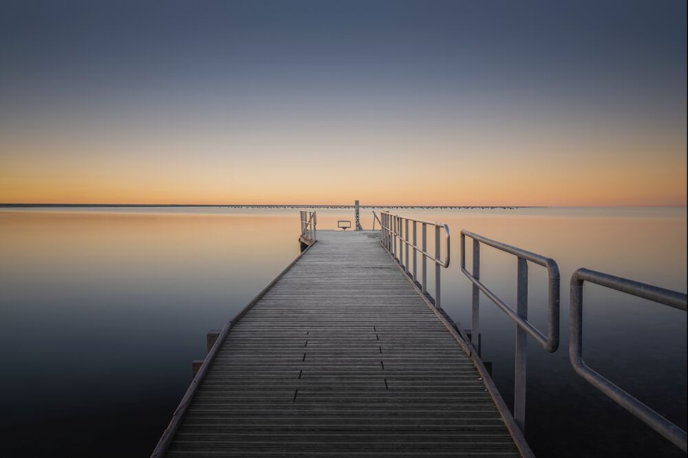 Dive into the silent sunset from the jetty