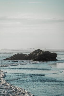 Solitary Rock in the Surf Timeless Stillness