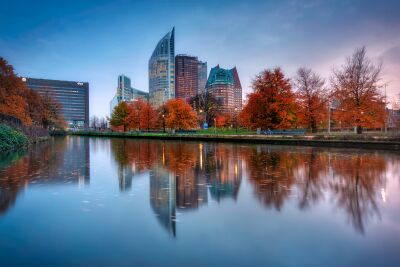 Autumn colors in The Hague with modern architecture and water Reflections