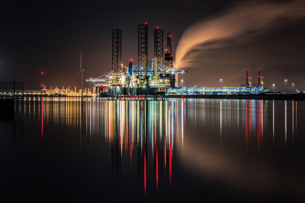 Industrial night photography of the Port of Rotterdam with reflections