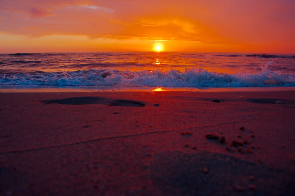 Zonsondergang aan zee