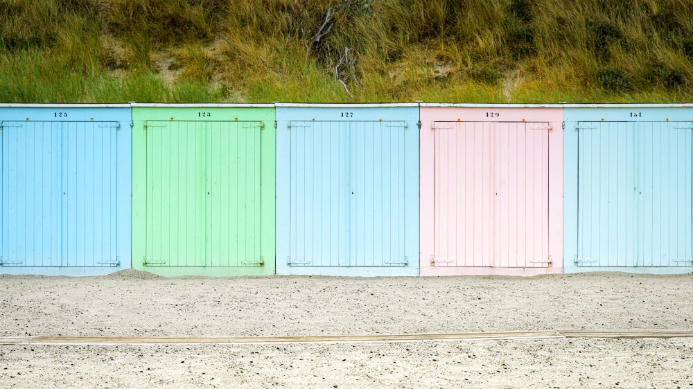 Summer colored beach houses by the sea at the seaside resort of Domburg