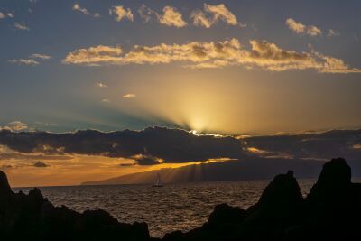 Stunning sunset with sailboat near Tenerife