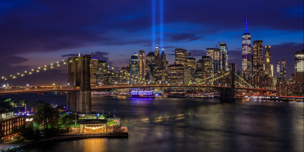 New York City Skyline and Brooklyn Bridge at dusk - September 11 Memorial