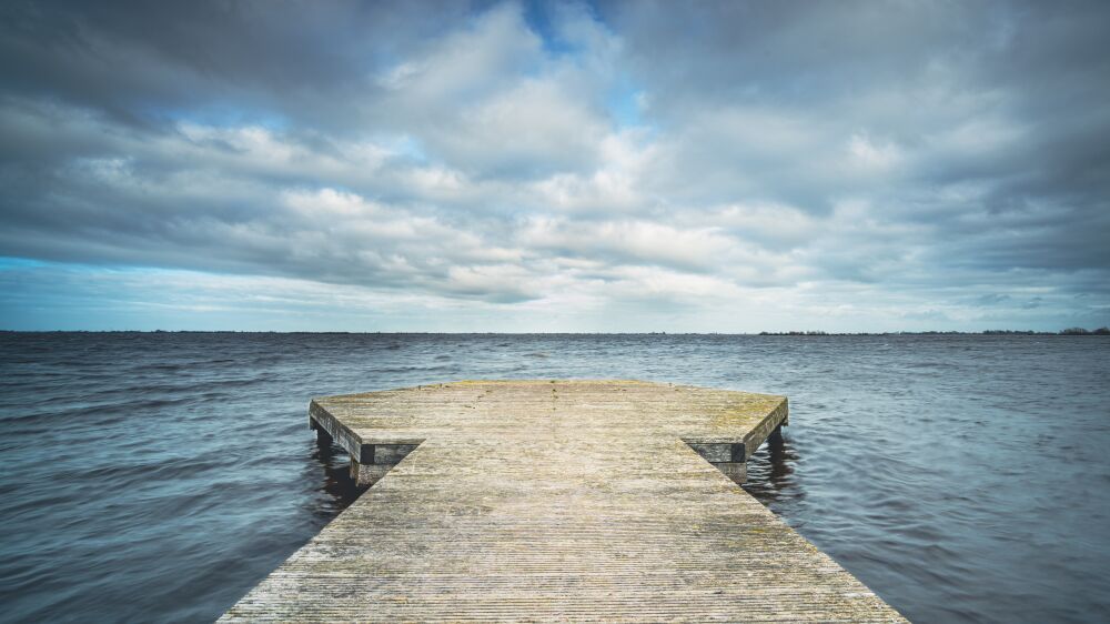 Wooden recreational jetty along the edges of the Frisian lakes in Holland