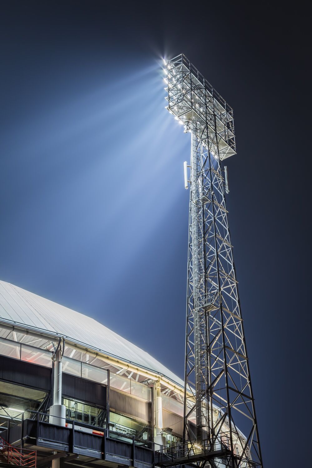 Stadium de Kuip located in Rotterdam Feijenoord with illuminated light pole in colour